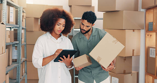 istock Team, logistics and people on tablet with boxes for discussion, inventory or stock backlog. Shipping, planning and supply chain for distribution, ecommerce package or business delivery in warehouse 2210198293