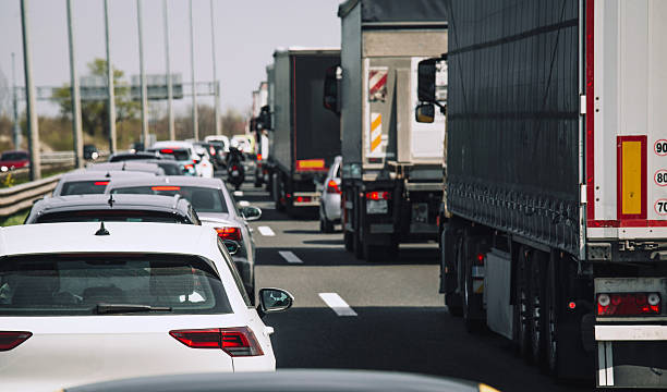 istock Traffic on the highway jam cars trucks 2210198618