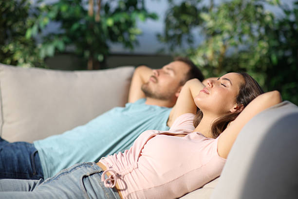 istock Couple resting and relaxing in a garden 2210201184