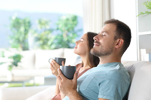 istock Couple at home relaxing and drinking coffee 2210201465