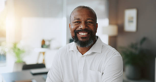 istock Mature, portrait and confident black man in office as proud project manager for development. Opportunity, professional and entrepreneur of startup company with mission or business commitment 2210207945