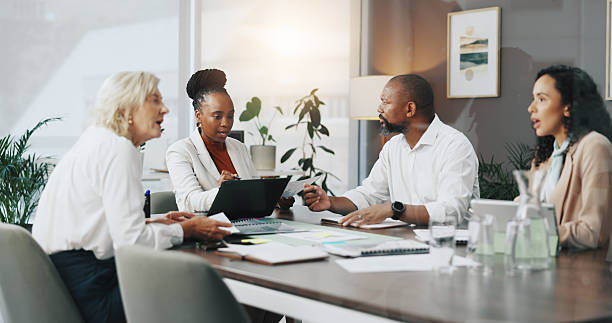 istock Laptop, planning and workshop with business people in office for strategy, project and research. Company growth, market report and brainstorming with employees in agency for discussion and teamwork 2210208021