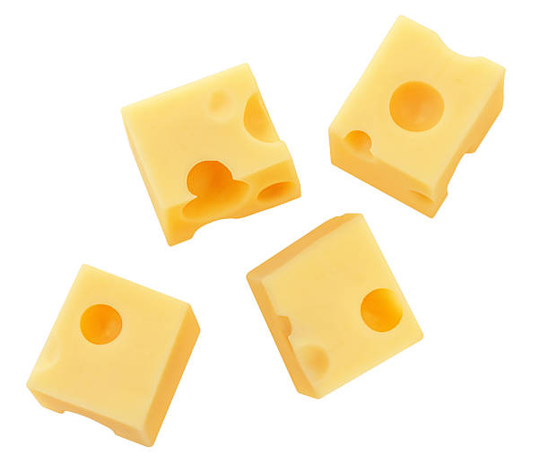 istock Flying Cheese pieces isolated on white. Levitating maasdam cheese cubes. Holey Cheese Explosion. Top view. Flat lay.  Package design element.  Creative layout 2210210171
