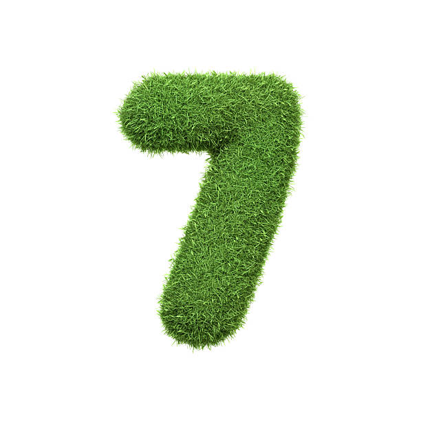 istock The number 7 shaped from dense green grass, set against a pure white backdrop 2210210733