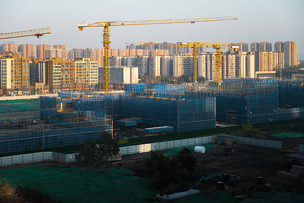 Sunrise over urban residential building under construction
