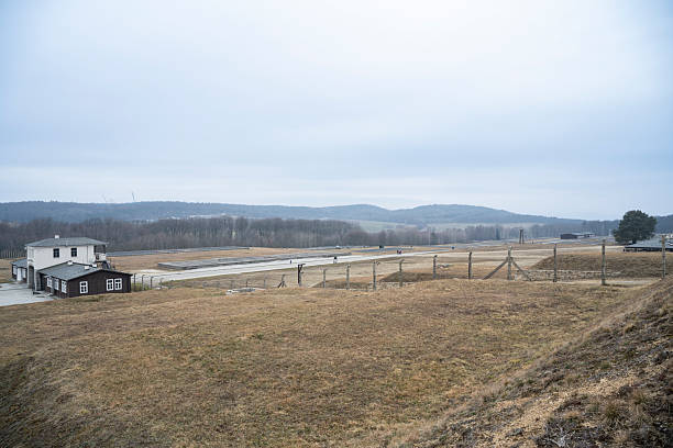 23 February 2025, Rogoźnica, Poland. Preserved foundations and empty barrack outlines stretch across the former Nazi concentration camp site in Poland, now a memorial.