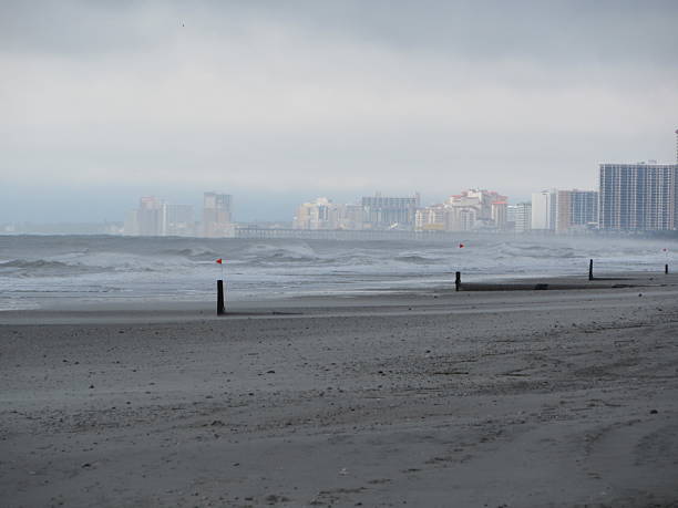 Post with red flags and Myrtle Beach in mist in background