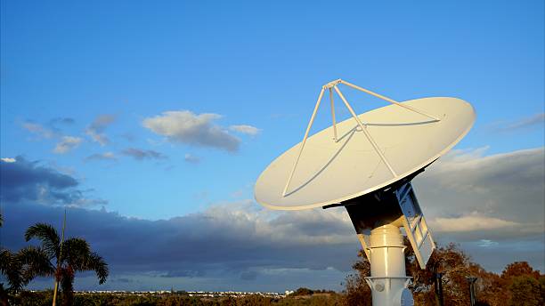istock Parabolic antenna pointing at the sky, capturing data and transmitting information 2210225624