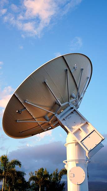 istock Large parabolic antenna pointing at the sky at sunset 2210225648