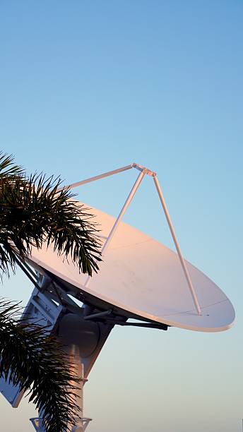 istock Large parabolic antenna pointing at the sky during sunset 2210225681