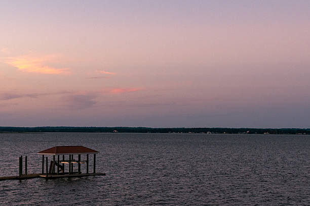 Lake Cabin on a calm lake at sundown in Athens, Texas, United States