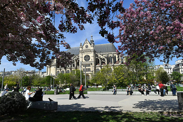 The Saint-Eustache church, Paris, France. Paris, France-04 08 2025: People on a park passing in front of the Saint-Eustache church in central Paris, France. église saint eustache stock pictures, royalty-free photos & images
