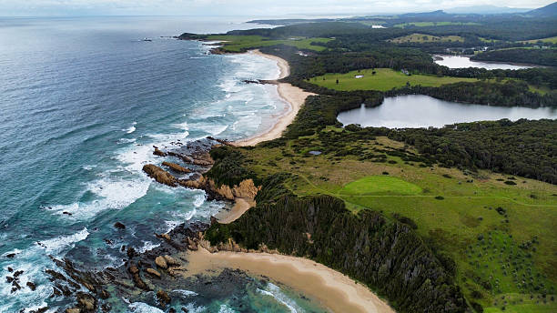 istock Rocks off the coast in rough seas, seen from above 2210231649