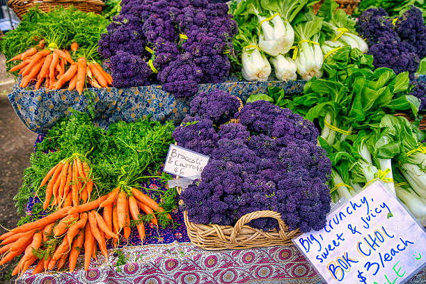 Fresh Farmer's market purple sprouting broccoli, carrots and wok choi
