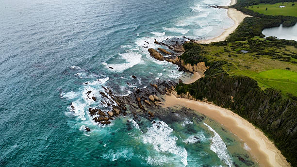 istock Rocks off the coast in rough seas, seen from above 2210233644