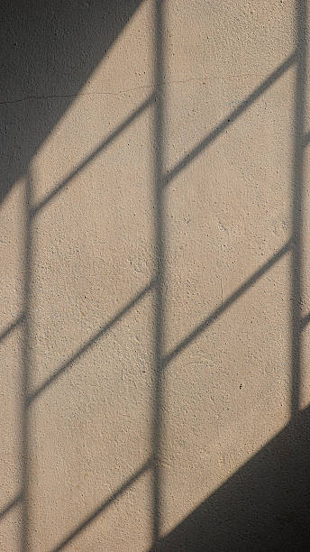 istock Vertical Shadows and Sunlight Art Wall Textures with Natural Light. 2210234319