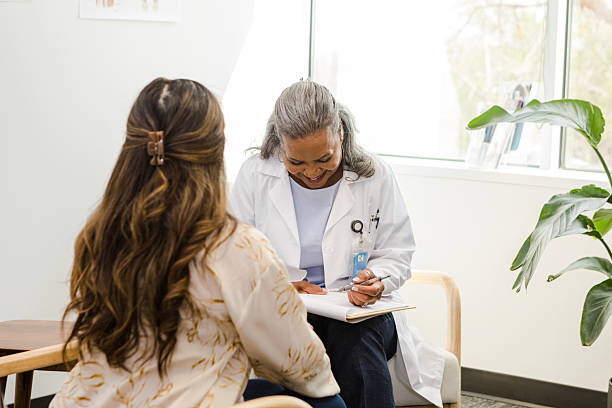 istock Doctor consulting a patient in her office 2210235237