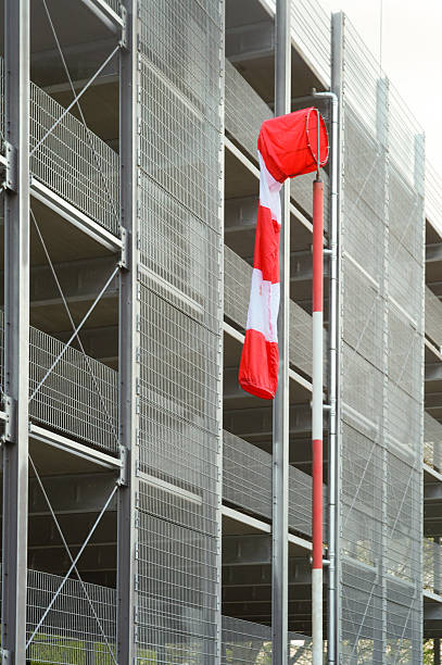 istock Windsock showing wind direction on a modern parking garage 2210235731