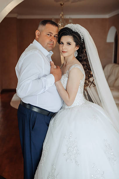 istock A man and a woman are posing for a picture 2210236565