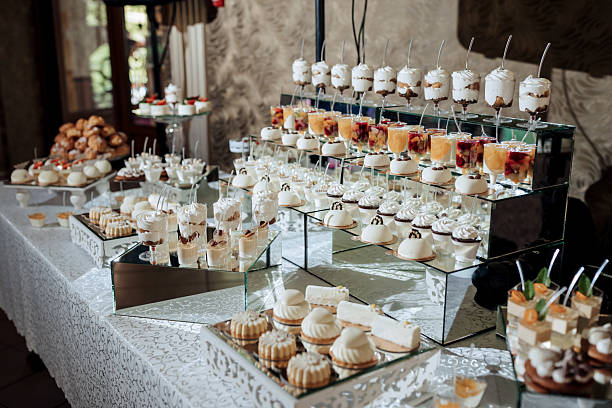 istock A table full of desserts and drinks with a white tablecloth 2210236798
