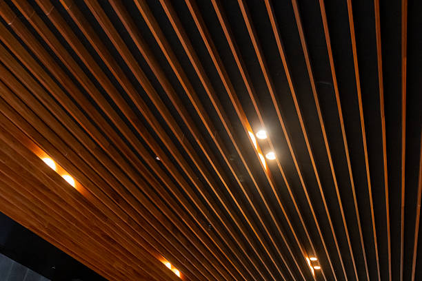 istock LED Downlight installed between wooden slat ceiling, creating scalloped lighting 2210238688