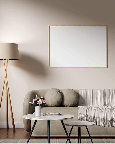 istock Horizontal wooden frame poster mockup above beige sofa with warm decor. 2210241584