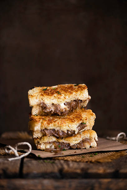 istock French Onion Grilled Cheese Sandwich on a rustic background 2210241786