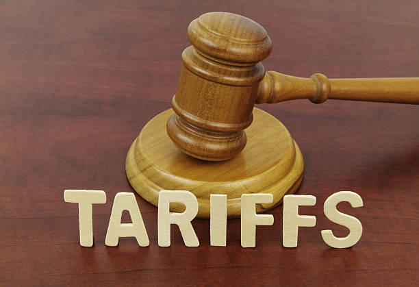 istock Word tariffs and judge gavel close-up. 2210241969