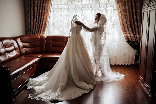 A middle aged man wears a wedding dress as a means to shatter stereotypes