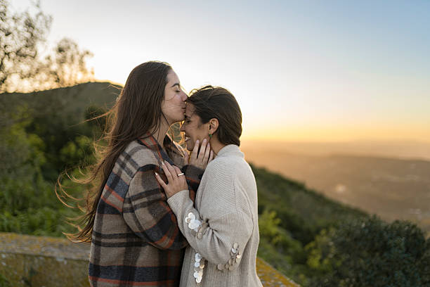 istock Affectionate lesbian couple at sunset in nature 2210245018