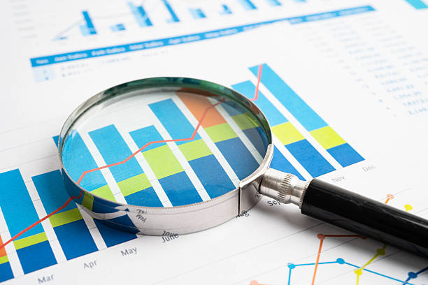 istock Magnifying glass on charts graphs paper. Financial development, Banking Account, Statistic, Investment Analytic research data economy. 2210249484