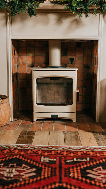 istock A fireplace with a basket of wood next to it 2210249802