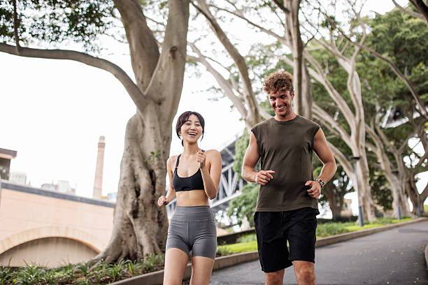 istock Couple Jogging Together 2210253130
