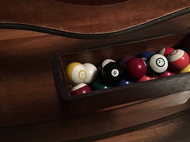 istock Billiard Balls in Container on Glass Table 2210253403