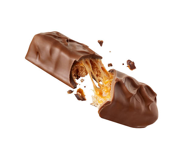 istock Chocolate bar with nuts crushed in the air isolated on a white background 2210253443