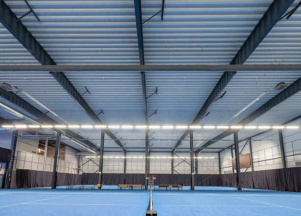 istock Professional Indoor Tennis Court Facility with Ample Lighting 2210254841