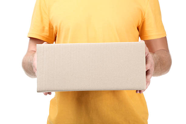 Courier delivering a large package, isolated on a white background.