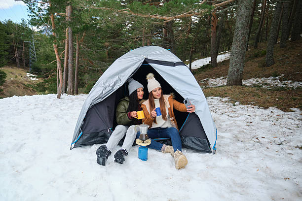 istock Two Young Women Taking a Selfie While Camping in the Snow 2210256603