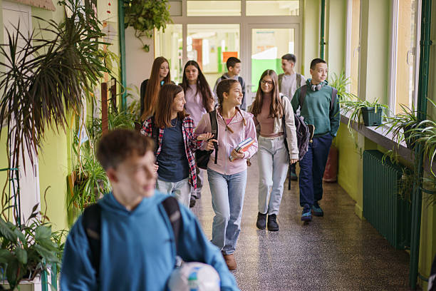 istock Children walk and talk as they leave school 2210256890