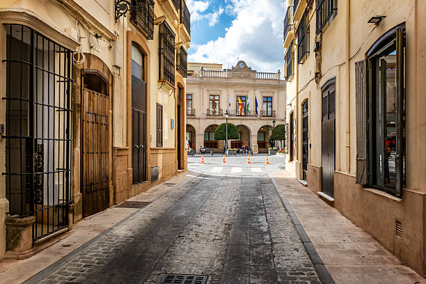 Ronda, Spain - November 11, 2024: Narrow street in European town Ronda, Spain