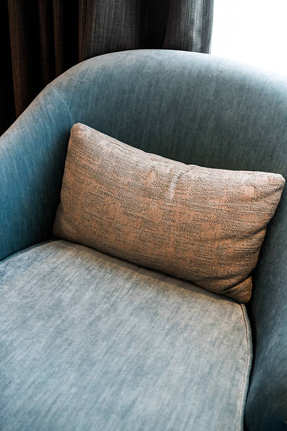 istock Stylish cushions on couch in living room. 2210257691