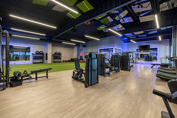 istock Modern Gym Interior with Equipment, Machines, and Mirrors in Well-Lit Environment 2210258214