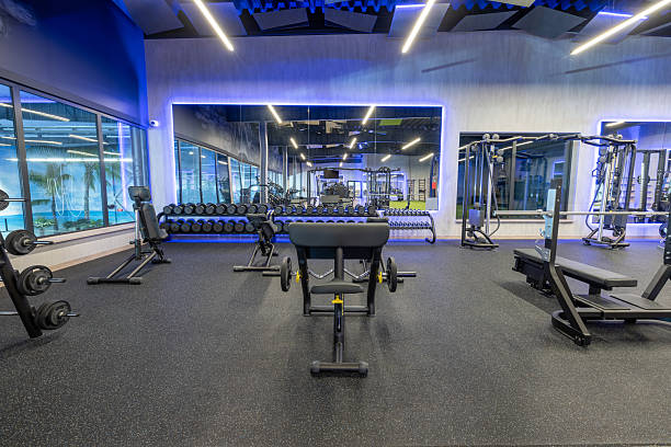 istock Modern Gym Interior with Equipment, Machines, and Mirrors in Well-Lit Environment 2210258228
