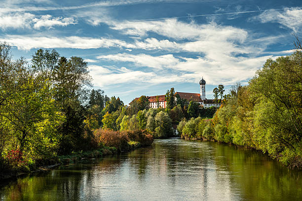 monastery, beuerberg abbey, in bavaria in the municipality of eurasburg near bad tölz. view from the loisach bridge straight onto the monastery.