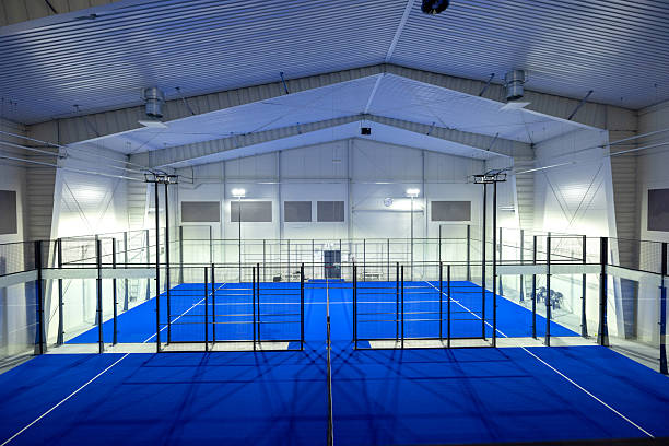 Modern Indoor Padel Court With Striking Blue Surface and Bright Lighting