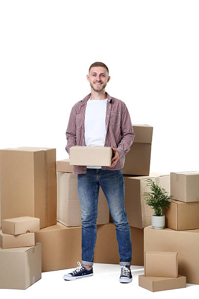 istock Young man with cardboard boxes on white background 2210258938