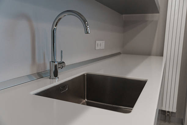 istock The kitchen sink with a mixer is clean in the kitchen 2210261106