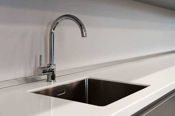 istock The kitchen sink with a mixer is clean in the kitchen 2210261132