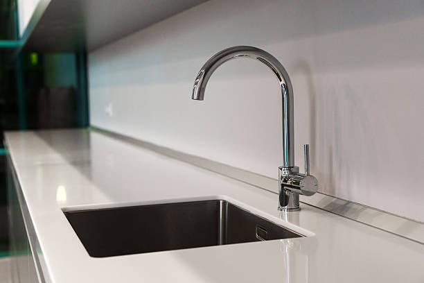 istock The kitchen sink with a mixer is clean in the kitchen 2210261195