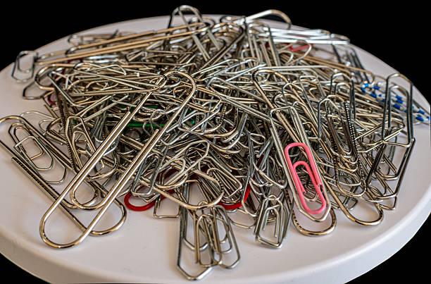 istock Close up of paper clips on a white surface . 2210261507